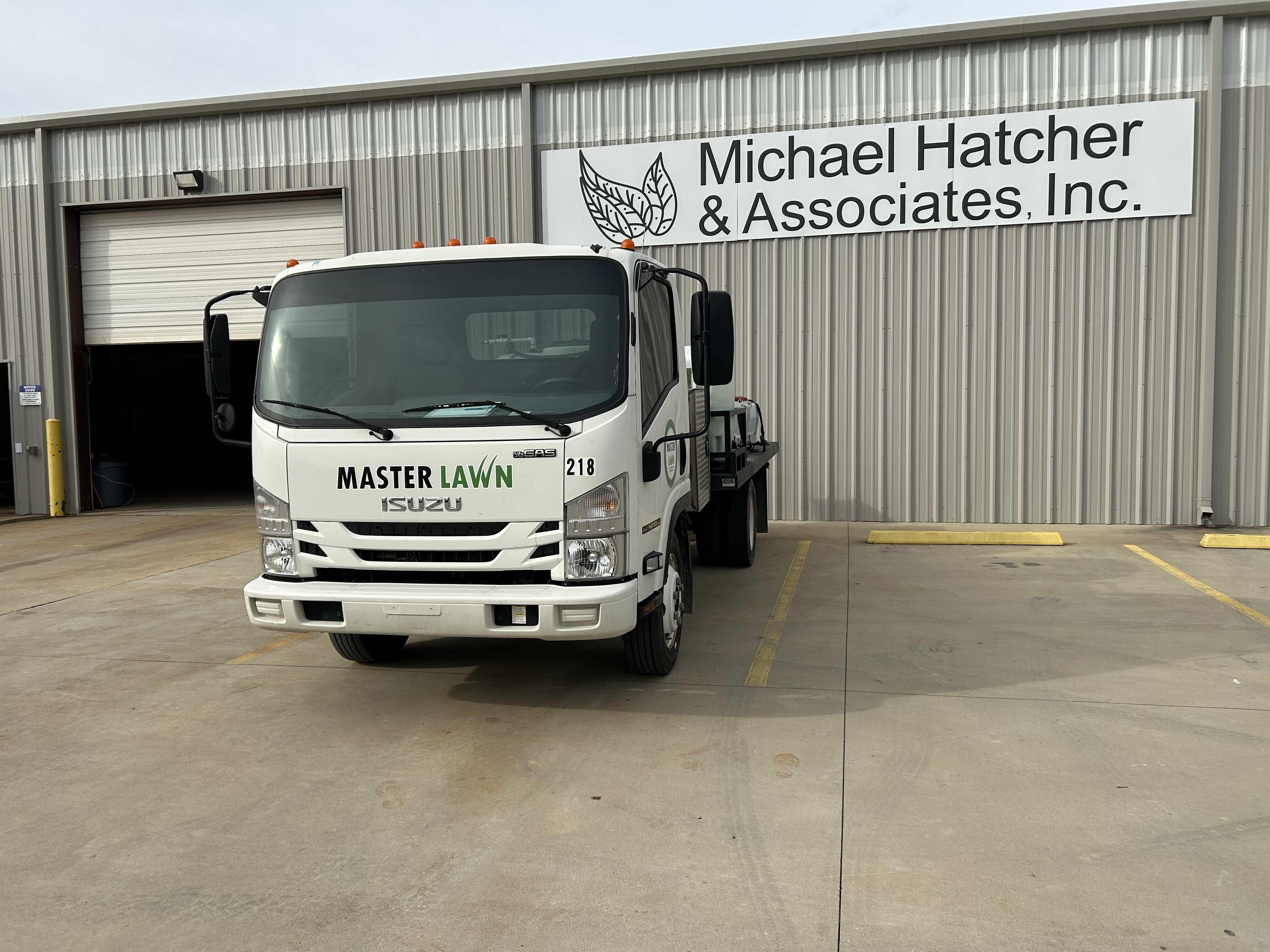 A Master Lawn truck is parked at Michael Hatcher & Associates' office